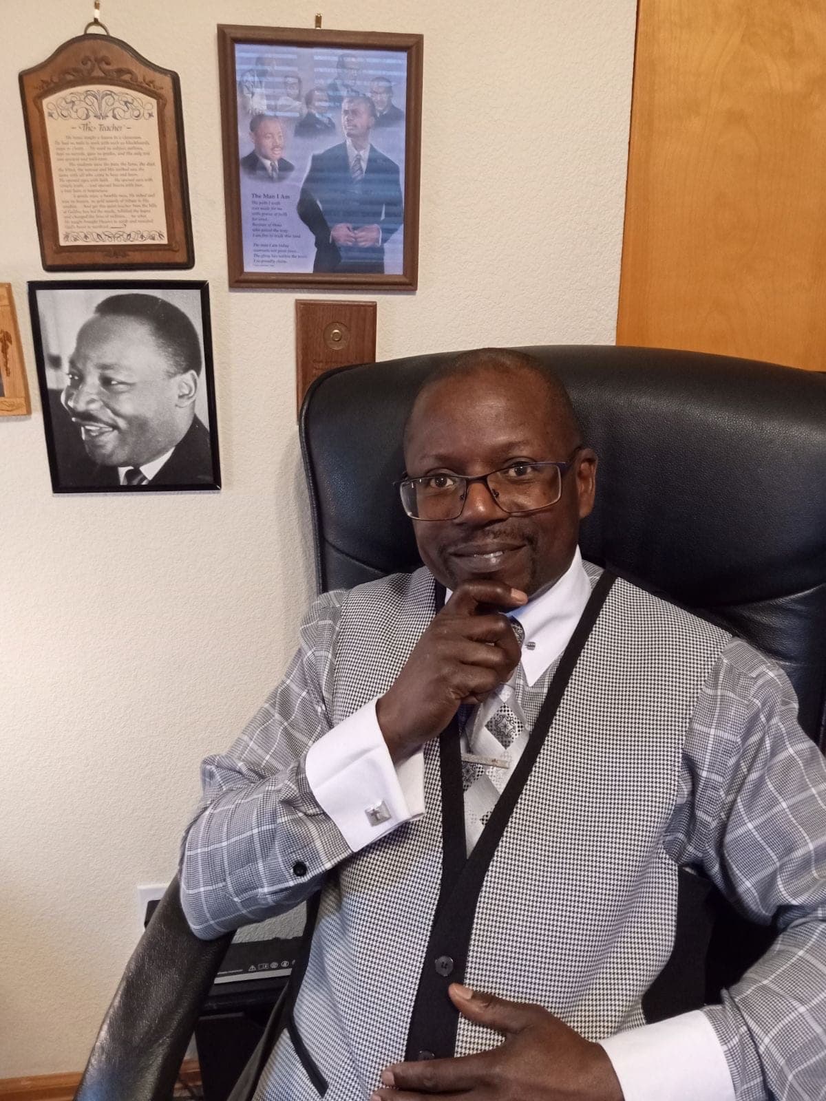 Pastor Paul Nelson seated in his office
